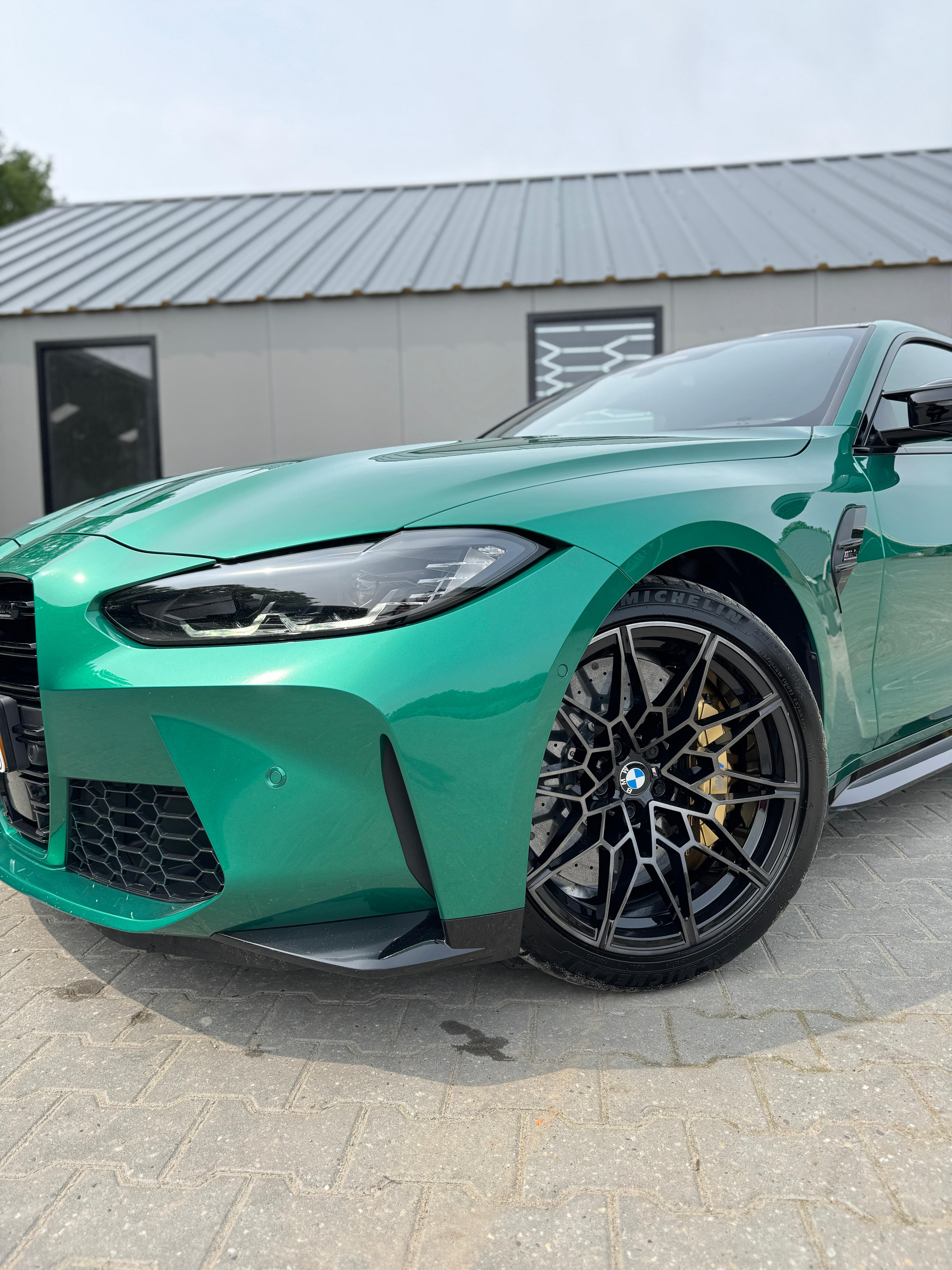 BMW M4 Competition green wheel detail